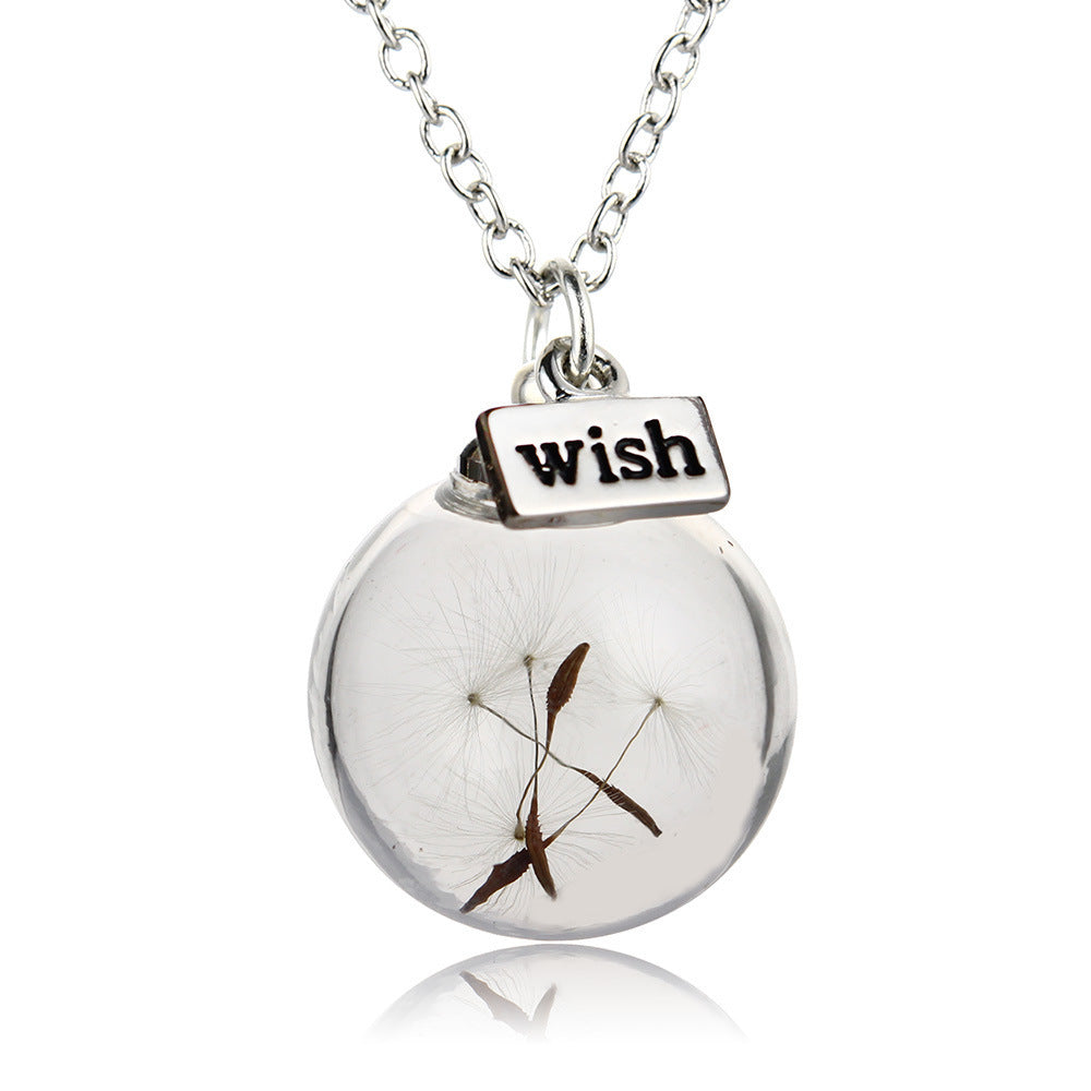 Dandelion glass pendant necklace styled for everyday wear